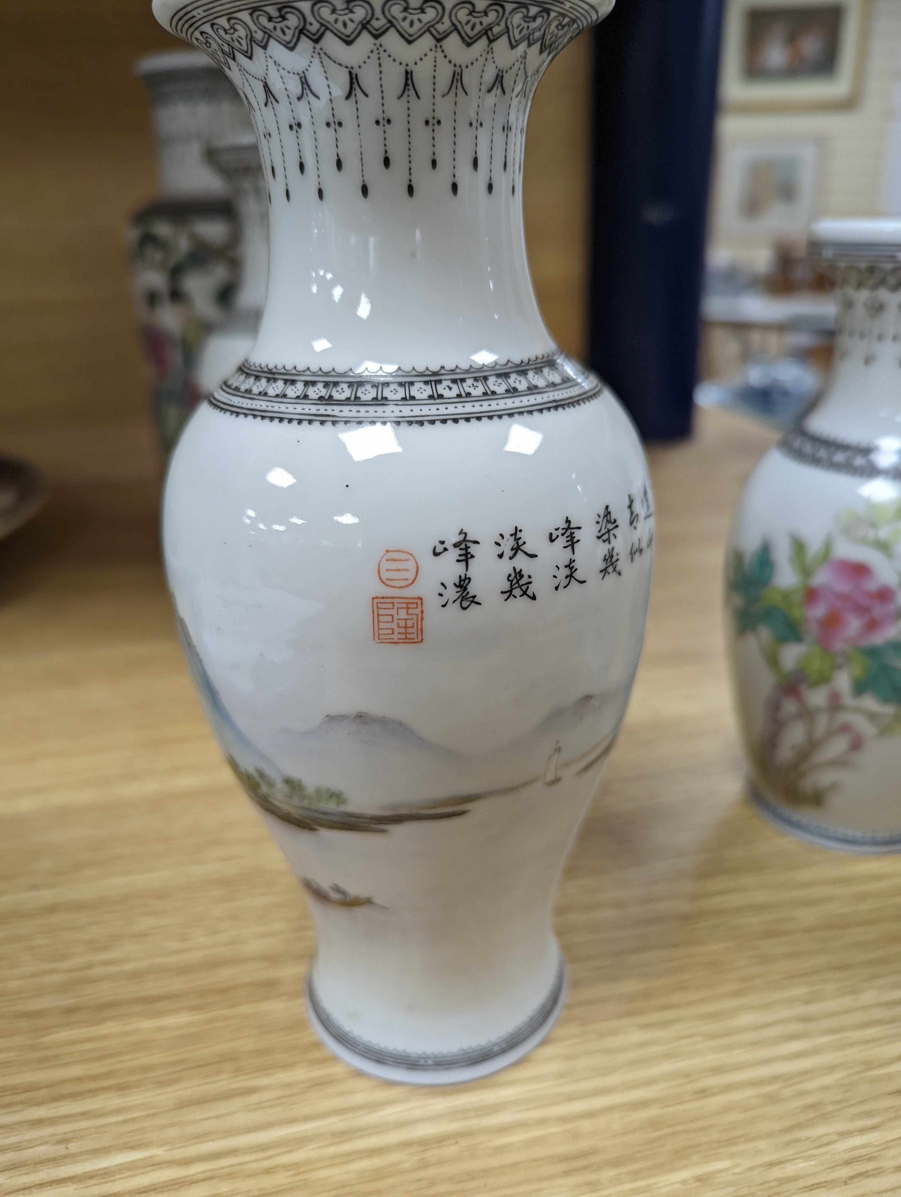 A group of seven Chinese famille rose vases, 20th century